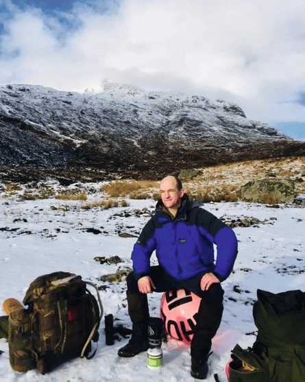 Man beside mountain