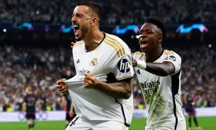 Joselu celebrates scoring his first goal with Vinícius Júnior