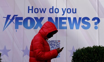 A person walks past the Fox News Headquarters at the News Corporation building in New York City on Thursday.