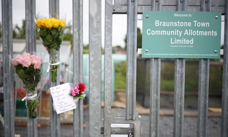 Flowers and tributes at the entrance to Braunstone allotments.