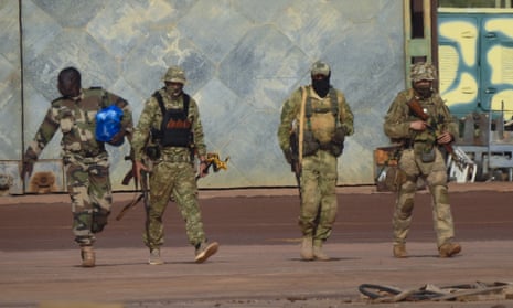 Three Russian mercenaries and a Malian soldier on patrol in northern Mali last year