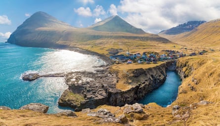 A small village in the Faroe Islands on a sunny day.