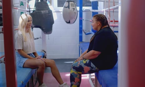 Christine McGuinness talks to Leanne, a young autistic woman, in a boxing gym