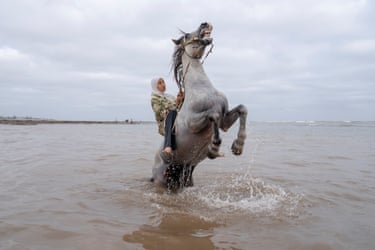 Ghita Jhiate manages her unruly stallion in the sea