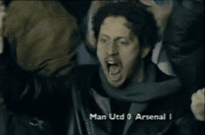 Arsenal fan Barry Ferst celebrates after Marc Overmars scores Arsenal’s winner at Old Trafford in 1998.