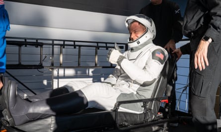 Crew leader Nick Hague gives a thumbs-up.