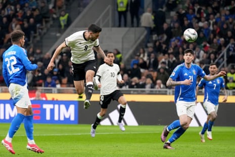 Germany's Tim Kleindienst, second left, scores.