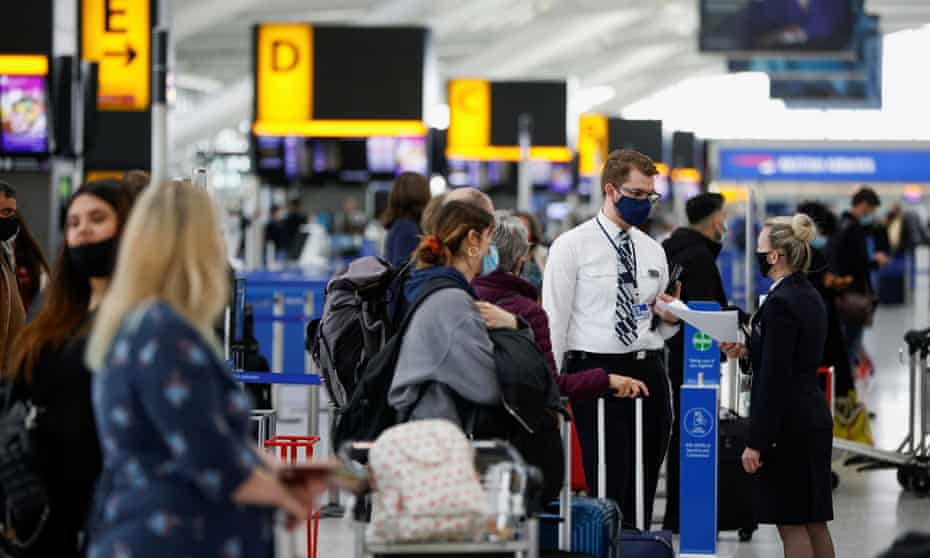 Passengers queue to check in at Heathrow