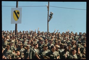 A crowd of American soldiers serving in the Vietnam war cheer at the Bob Hope touring show that visited Vietnam at Christmas 1968