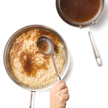 adding a ladleful of stock