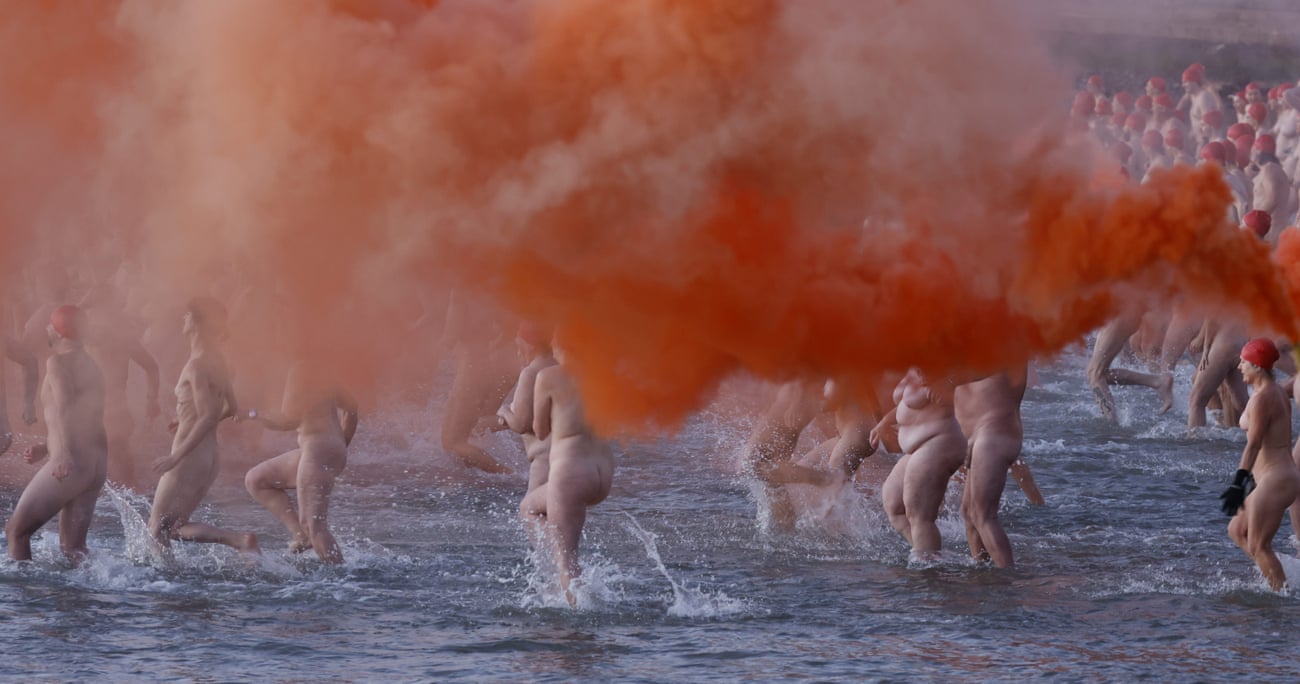 Swimmers enter the water