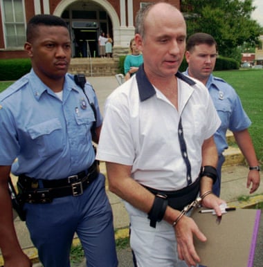 Larry Lonchar is escorted from the Butts County Courthouse in Jackson, Georgia.