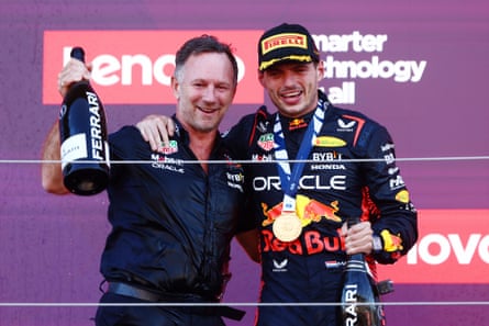 Max Verstappen celebrates on the podium with the Red Bull team principal, Christian Horner.