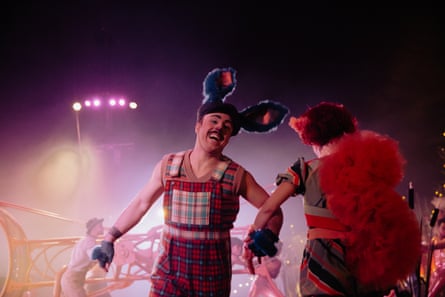 a man in a jumpsuit with a big-eared hat on