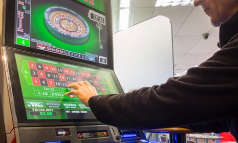 Man gambling on fixed-odds betting terminal