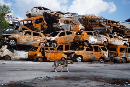 A pile of burnt-out cars several vehicles high