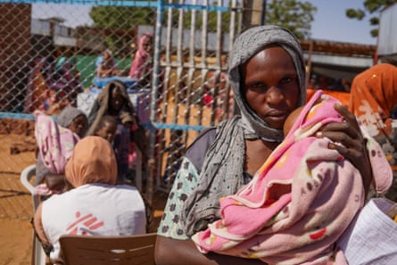 A woman and baby at the Zamzam displacement camp in North Darfur