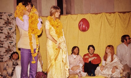 ‘In a way, the Beatles never left India’ … George and Patti Harrison with garlands while the other members of the band look on.