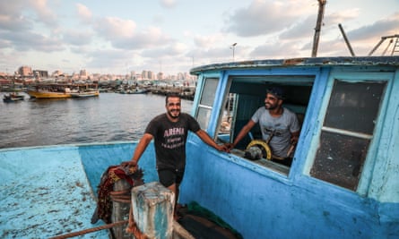 Said Abu Odeh (left), 24, and Mohammed Abu Odeh (right), 28, in a family-owned fishing boat in Gaza.