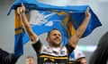 Rob Burrow waves a Leeds flag