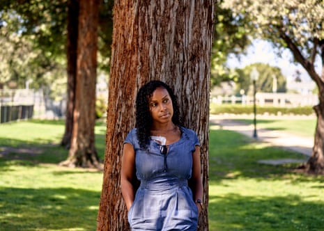 Ashanti Daniel, 40, a former nurse, poses for a portrait at a park in Beverly Hills.
