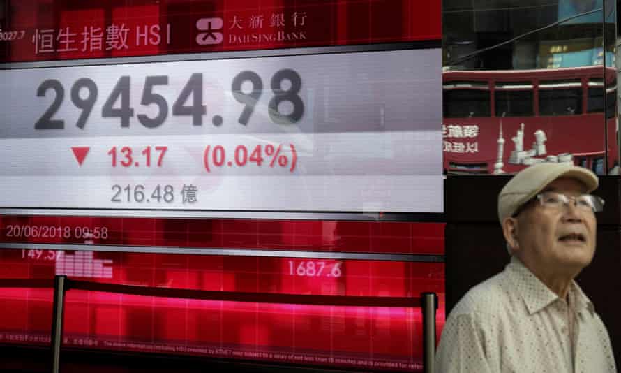 An electronic board showing the Hong Kong share index outside a bank in Hong Kong today