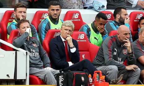 Arséne Wenger and the Arsenal bench feel the strain at Anfield