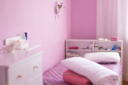 Simply furnished pink bedroom at the National Cancer Center, Mongolia.