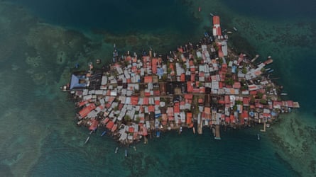An aerial photograph of Kanir Dup showing the land almost entirely covered with tin roofs.