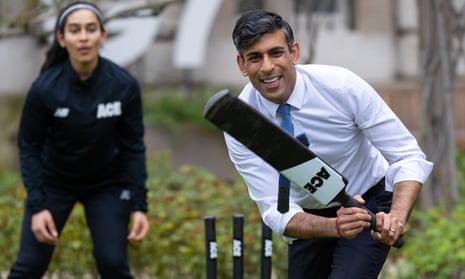 Rishi Sunak plays a game of cricket in the Downing Street garden. 