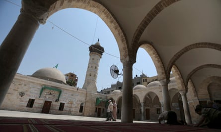 Men pray at the Great Omari mosque