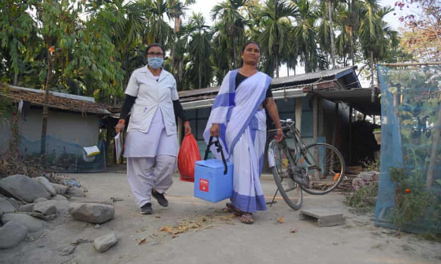 A Nurse along with a health worker during door- door vaccination drive in in Baksa district of Assam, India on Wednesday 22nd December