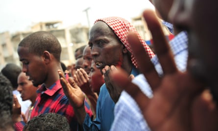 Somalis pray for victims of a massive al-Shabaab truck bomb attack in Mogadishu in October 2017.
