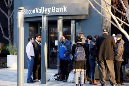 Customers stand outside the Silicon Valley Bank headquarters in Santa Clara