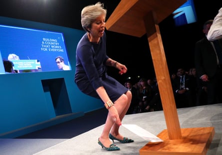 Theresa May discards a fake P45 termination of employment letter she was handed by a delegate. The British prime minister was speaking at the Conservative party conference in Manchester