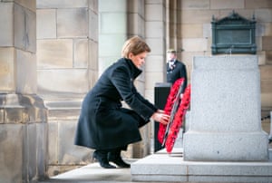 The first minister of Scotland, Nicola Sturgeon, lays a wreath during the Remembrance Sunday service at the Stone of Remembrance outside Edinburgh city chambers