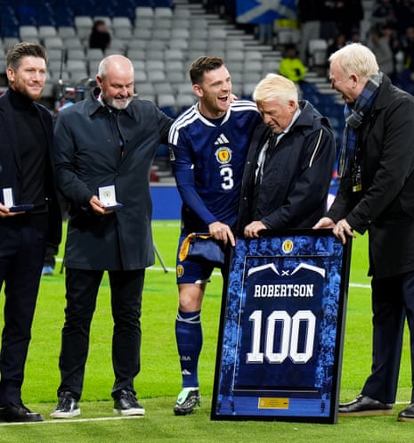 Scotland's Andrew Robertson receives his 100th cap award with Scotland manager Sebastien Pocognoli with former managers Steve Clark, Alex McLeish and Gordon Strachan.