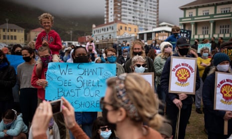 People take part in a protest against the plan by Dutch oil company, Shell, to conduct underwater seismic surveys along South Africa in 2021