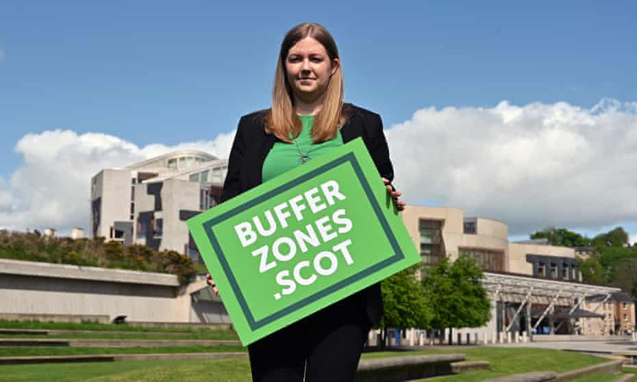 MSP Gillian Mackay holds a placard outside Holyrood in support of the creation of buffer zones around abortion clinics.