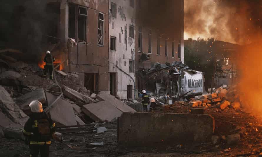 Firefighters work at the site of fire after Russian shelling in Mykolaiv, Ukraine on Saturday, 18 June.