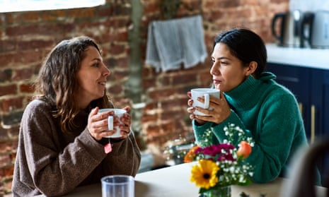 Two friends talking over coffee