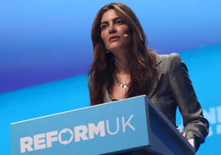 Cunningham speaks at a Reform-branded lectern at the ExCel centre in London