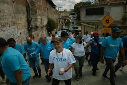 Vente Venezuela activists walk through La Dolorita neighbourhood in Caracas.