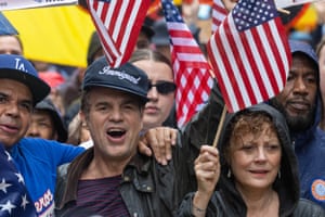 people hold US flags