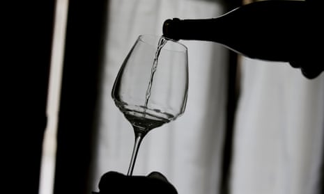 Silhouette of wine being poured into glass
