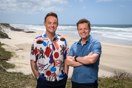 Ant and Dec smiling in front of a beach backdrop