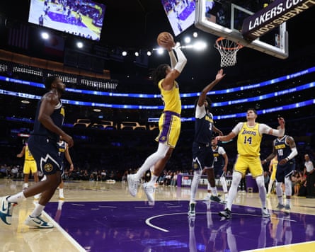 Los Angeles Lakers guard Matisse Thybulle dunks during a preseason NBA basketball game against the Denver Nuggets