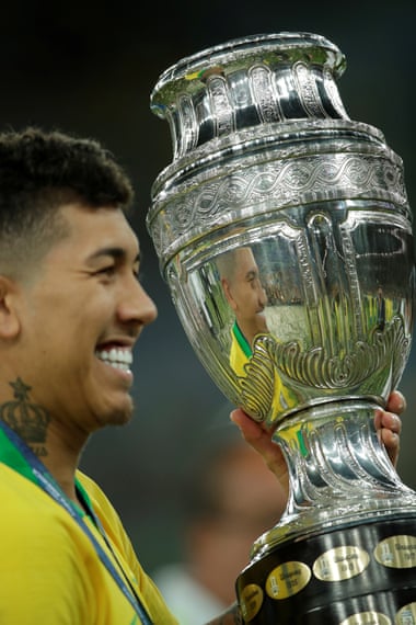 Roberto Firmino celebrates winning the Copa América earlier this year.