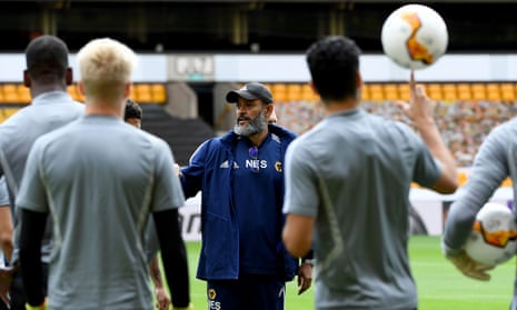 Wolves manager Nuno Espírito Santo talks to his players during training