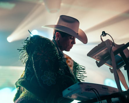 musician performs with hat